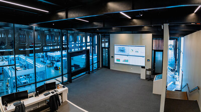Wall-mounted display in a glass-fronted commercial interior